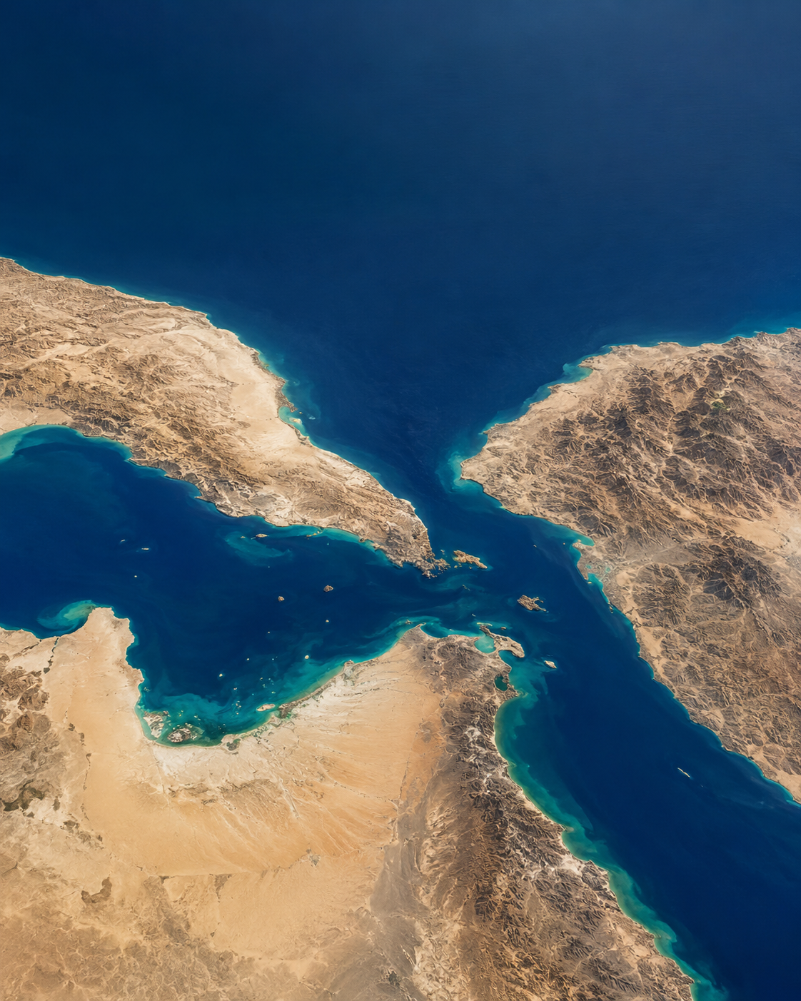 Satellite photograph showing a strategic maritime strait and coastline along Middle Eastern shipping routes.
